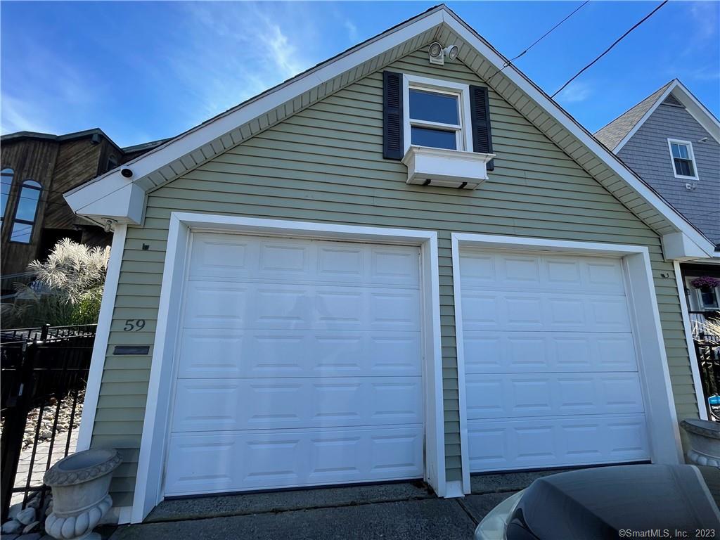 59 Melba Street Milford, CT 06460 - Photo 36 of 38 a front view of a house with wooden walls