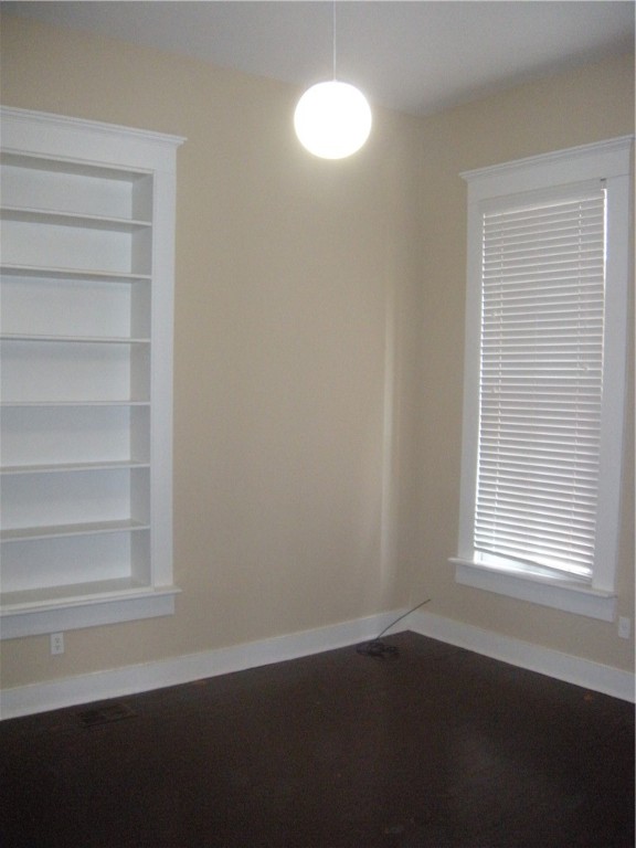 915 West 23rd Street, Unit C Austin, TX 78705 - Photo 13 of 22 a view of an empty room with a window