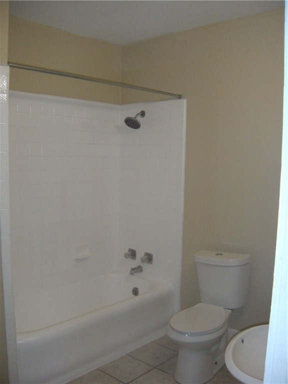 915 West 23rd Street, Unit C Austin, TX 78705 - Photo 16 of 22 a white toilet sitting next to a bath tub