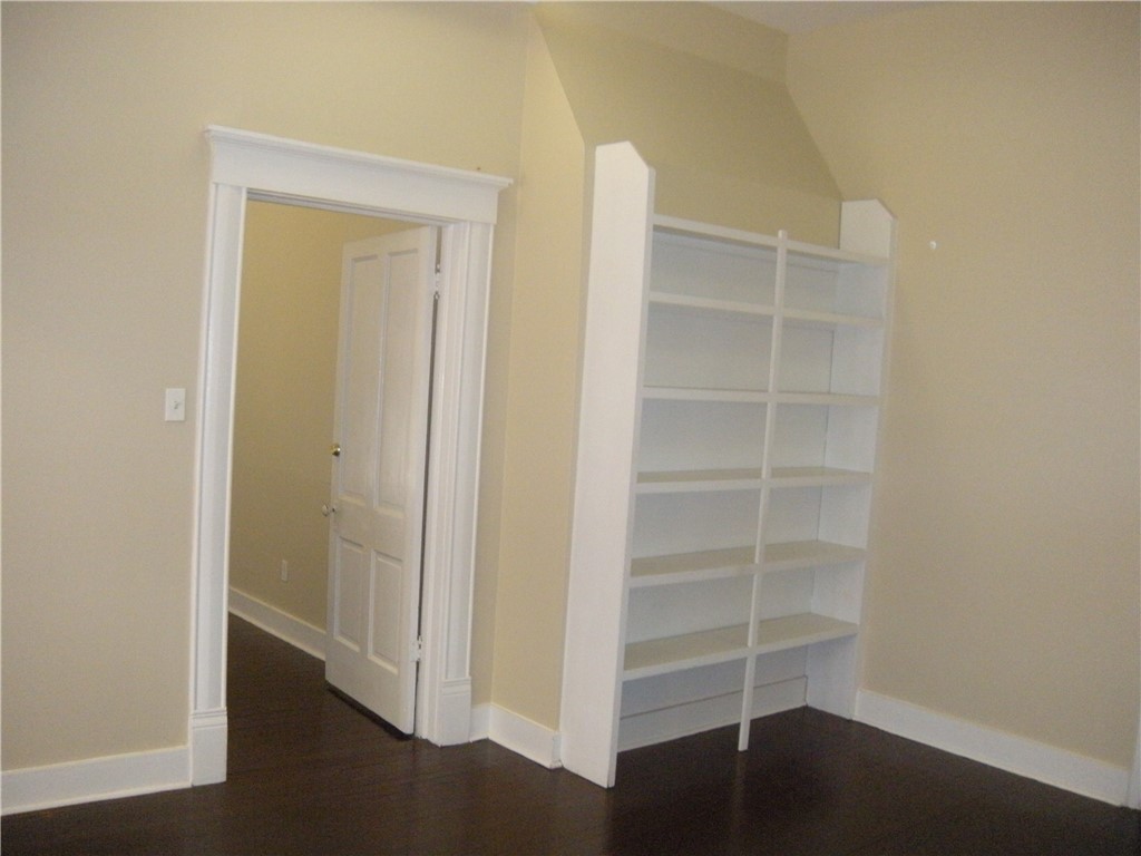 915 West 23rd Street, Unit C Austin, TX 78705 - Photo 5 of 22 a view of walk in closet with empty racks
