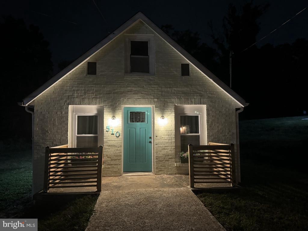 510 67th Place Capitol Heights, MD 20743 - Photo 1 of 15 a front view of a house with a yard