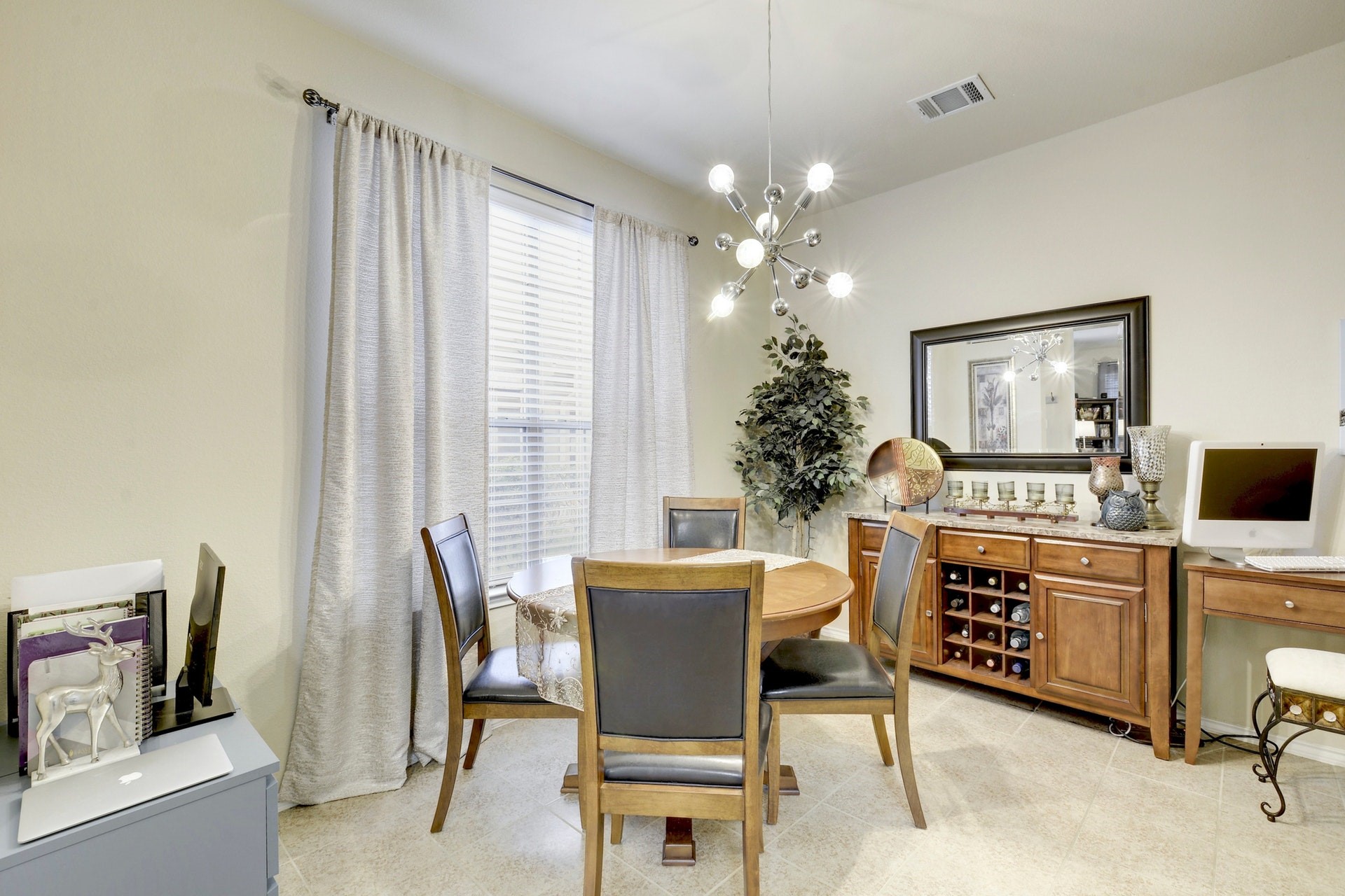 14815 Avery Ranch Boulevard, Unit 1103 Austin, TX 78717 - Photo 11 of 25 a view of a dining room with furniture and a chandelier
