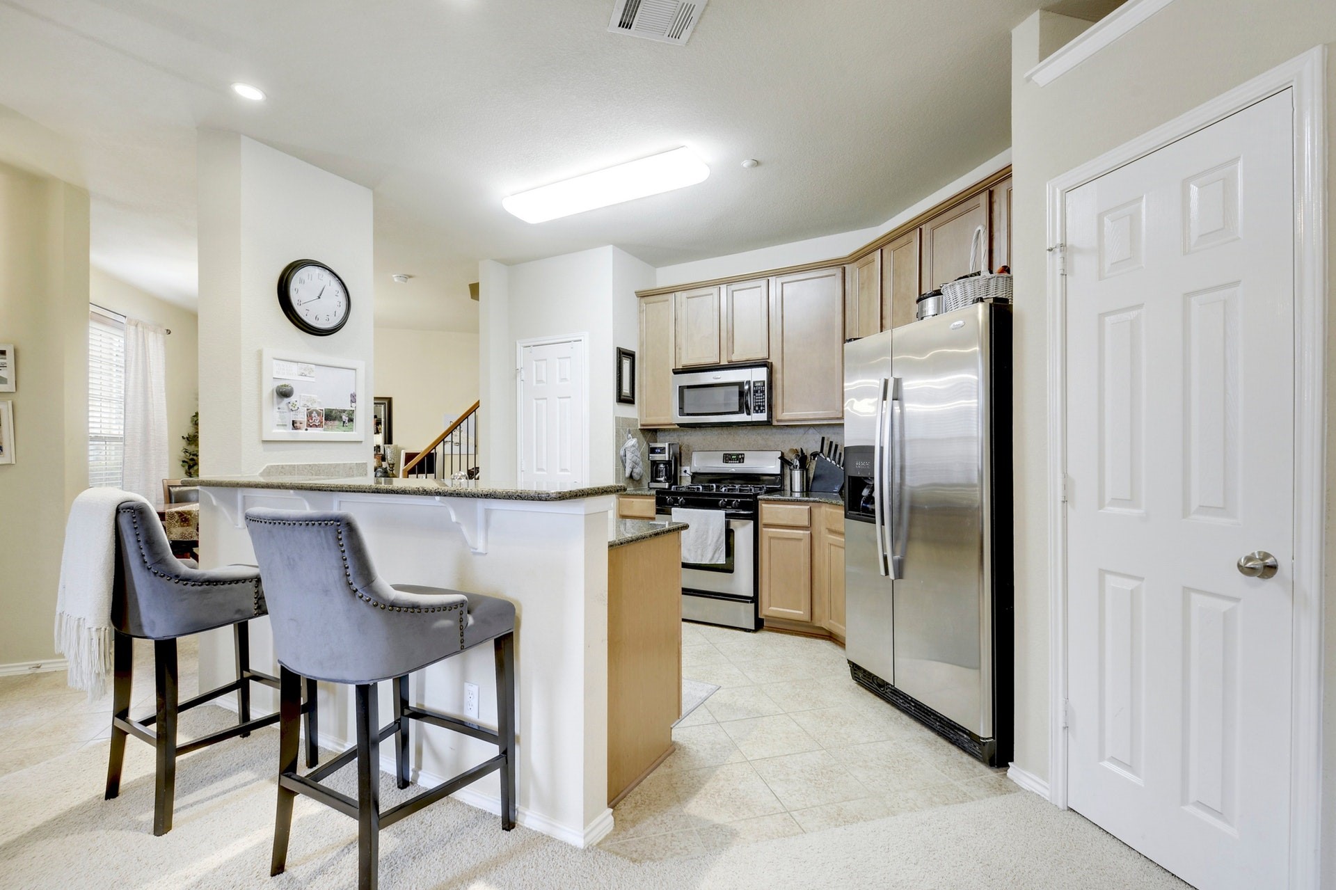 14815 Avery Ranch Boulevard, Unit 1103 Austin, TX 78717 - Photo 6 of 25 a kitchen with stainless steel appliances granite countertop a refrigerator and a stove top oven