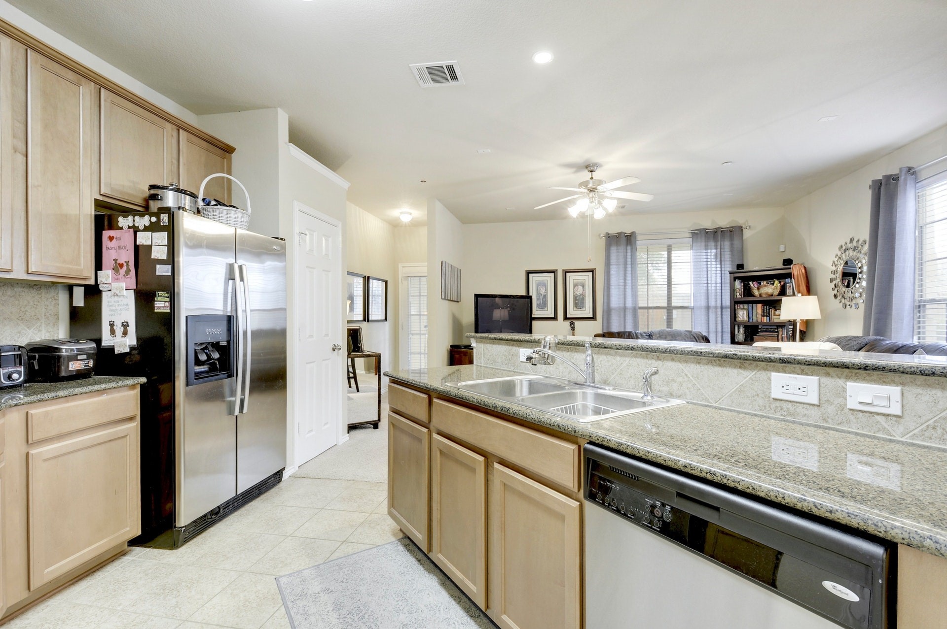 14815 Avery Ranch Boulevard, Unit 1103 Austin, TX 78717 - Photo 8 of 25 a kitchen with stainless steel appliances granite countertop a sink a stove and a refrigerator