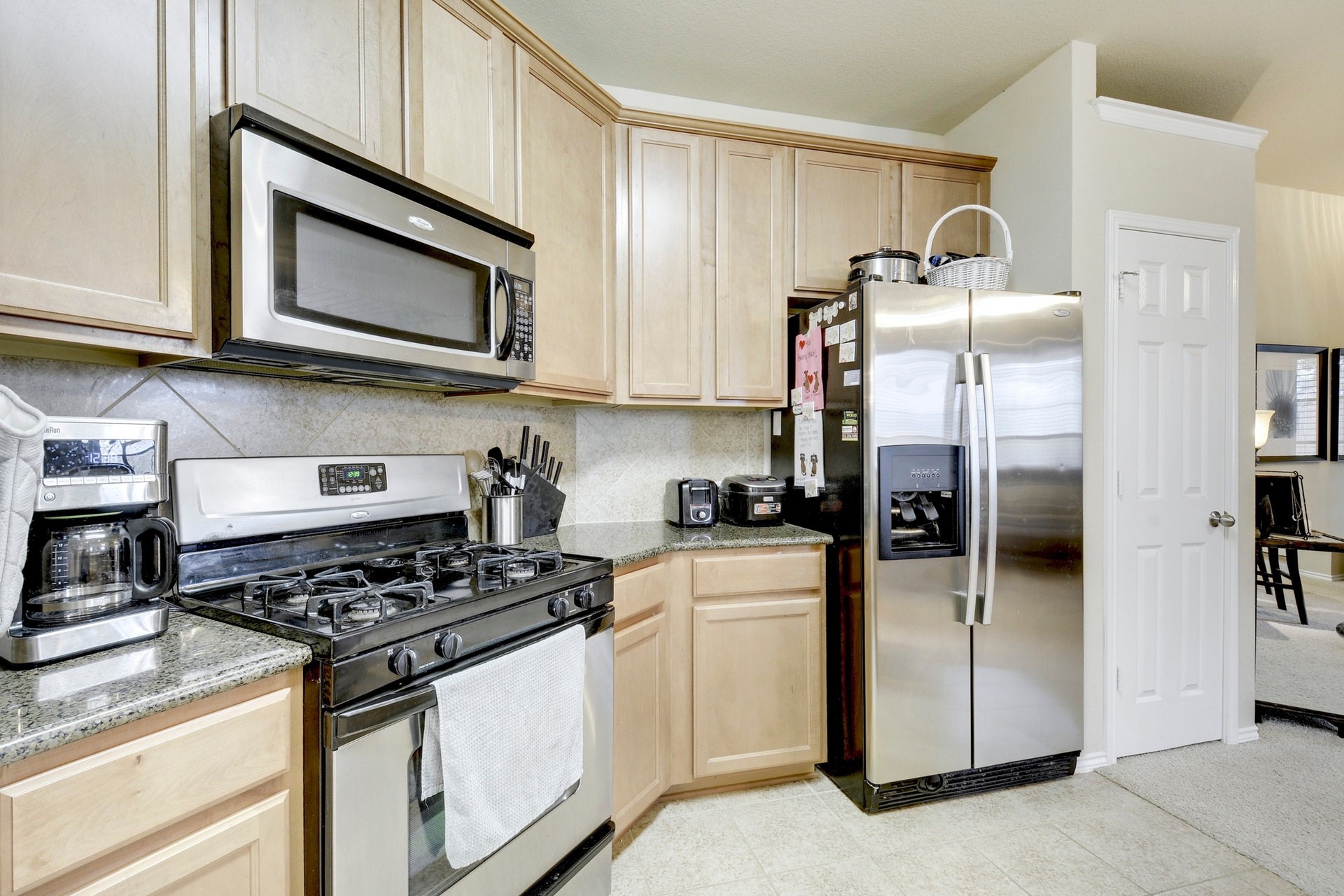 14815 Avery Ranch Boulevard, Unit 1103 Austin, TX 78717 - Photo 10 of 25 a kitchen with stainless steel appliances granite countertop a refrigerator stove and sink
