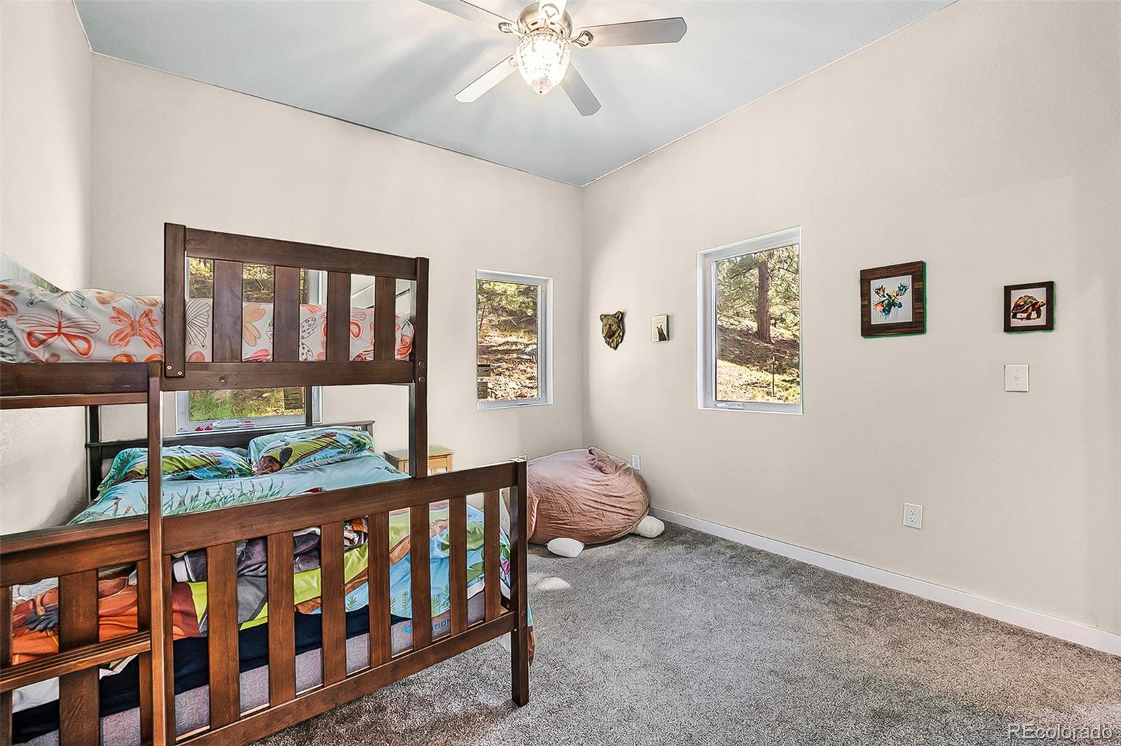 32 Oak Way Evergreen, CO 80439 - Photo 29 of 40 a bedroom with furniture and a window