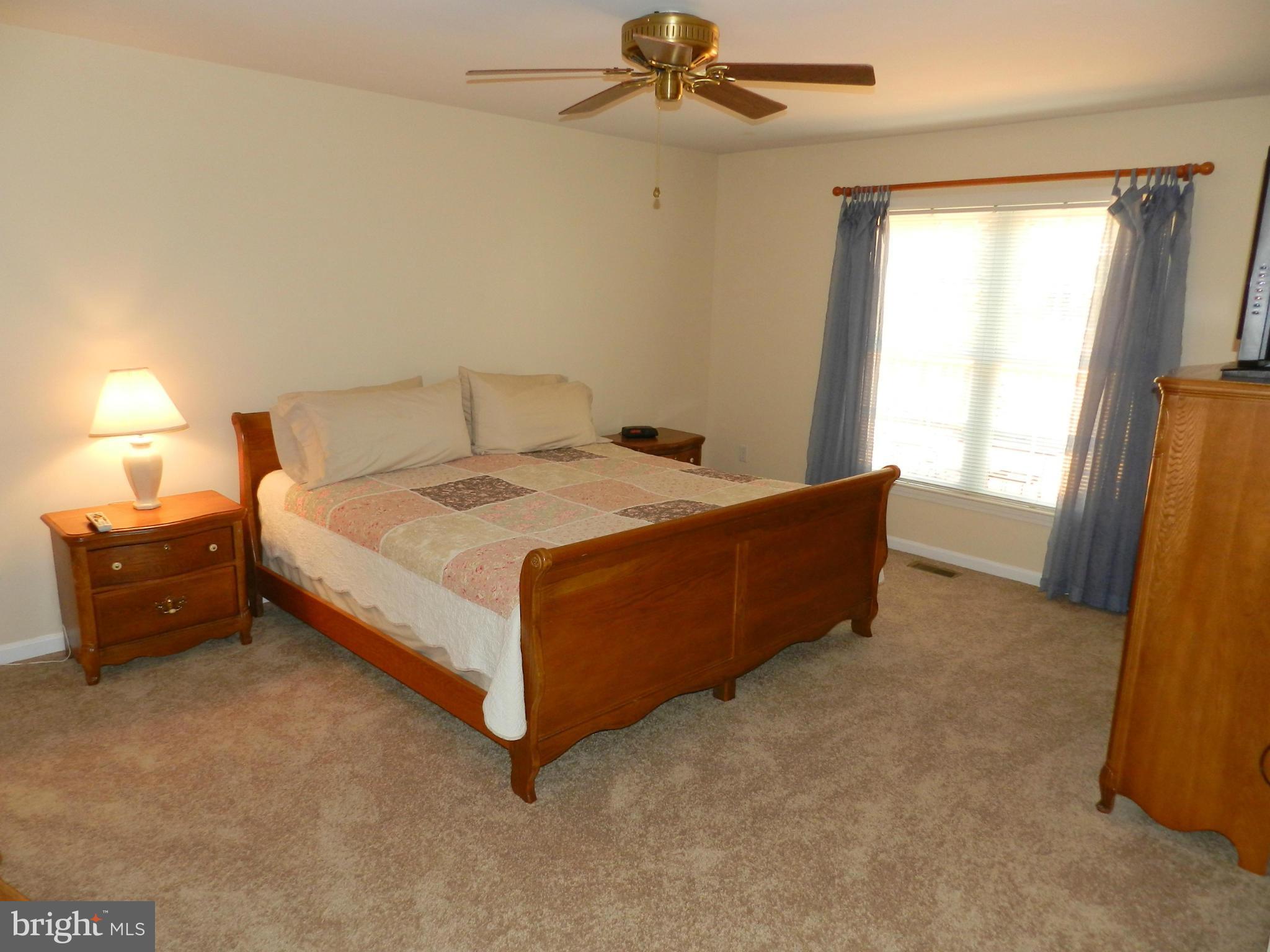 18401 Barnesville Road Barnesville, MD 20838 - Photo 14 of 30 a bed sitting in a bedroom next to a window