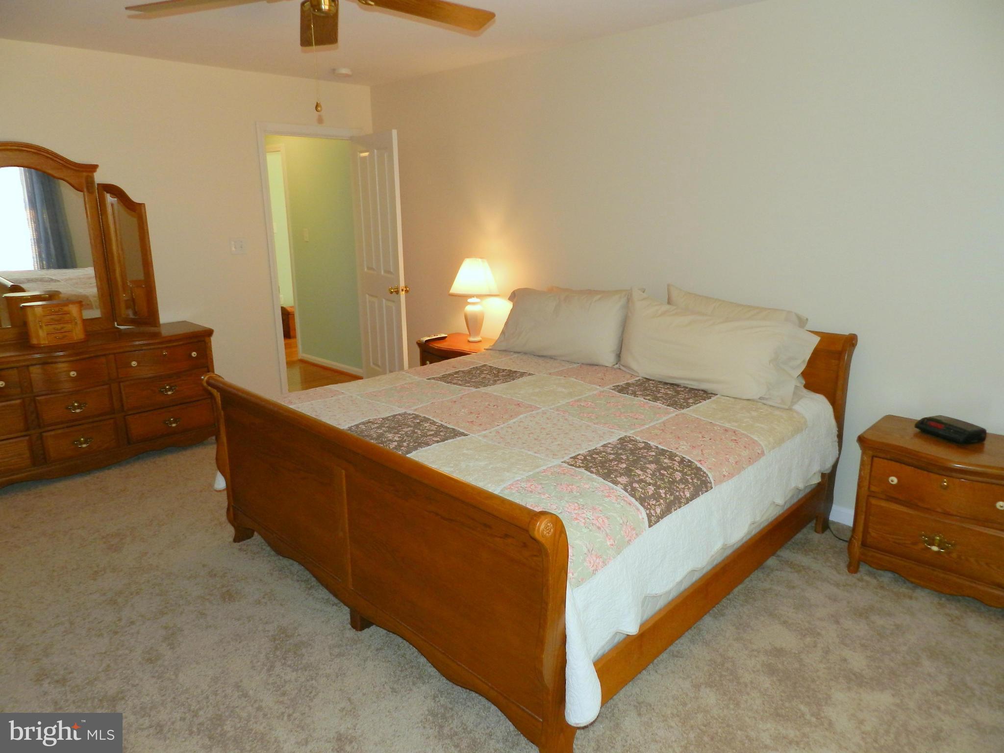 18401 Barnesville Road Barnesville, MD 20838 - Photo 15 of 30 a bedroom with a bed and dresser