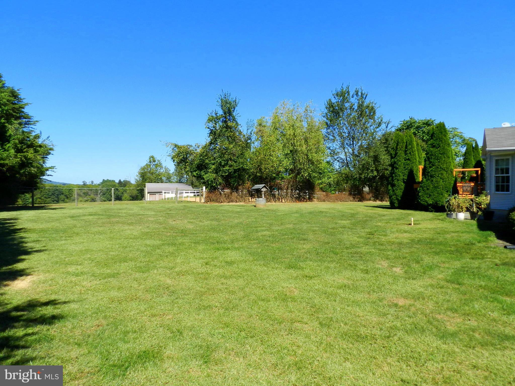 18401 Barnesville Road Barnesville, MD 20838 - Photo 3 of 30 a view of a grassy field with trees