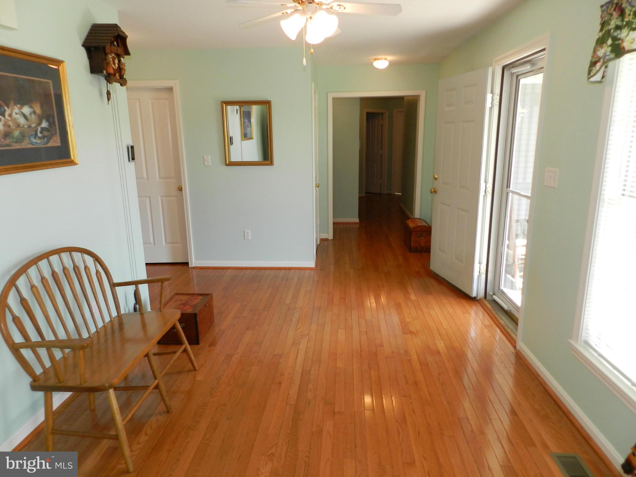 18401 Barnesville Road Barnesville, MD 20838 - Photo 7 of 30 a view of a hallway with wooden floor and staircase