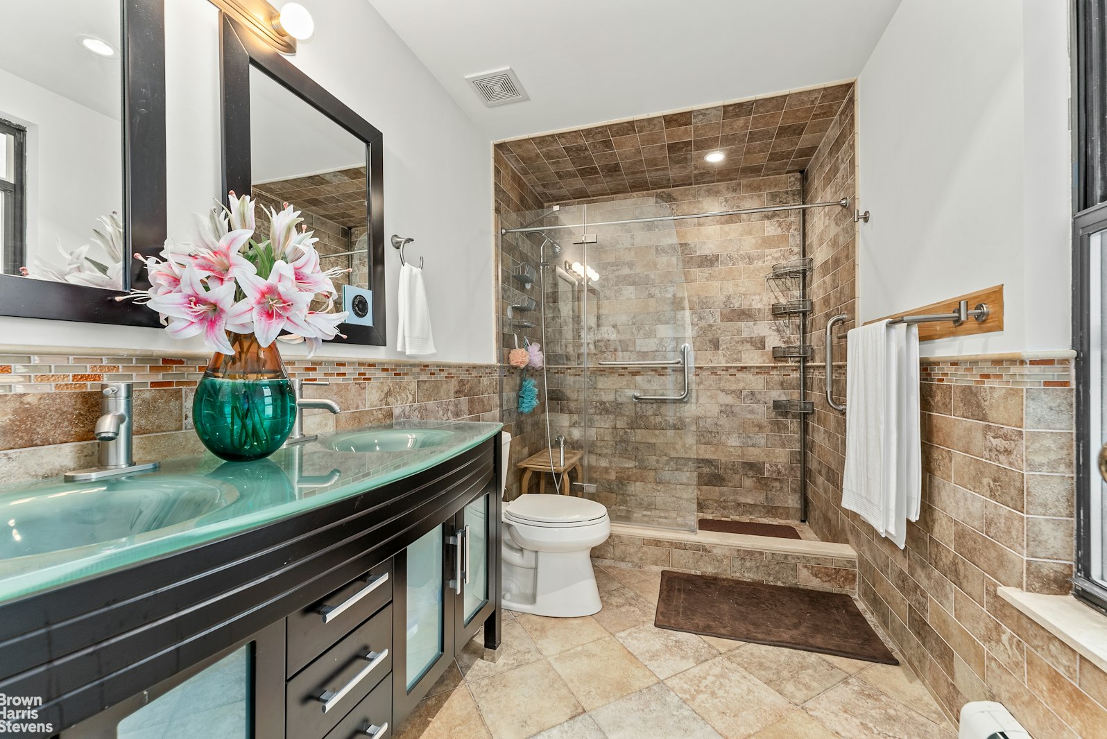 131 East 38th Street Manhattan, NY 10016 - Photo 10 of 26 a bathroom with a granite countertop sink a toilet and shower
