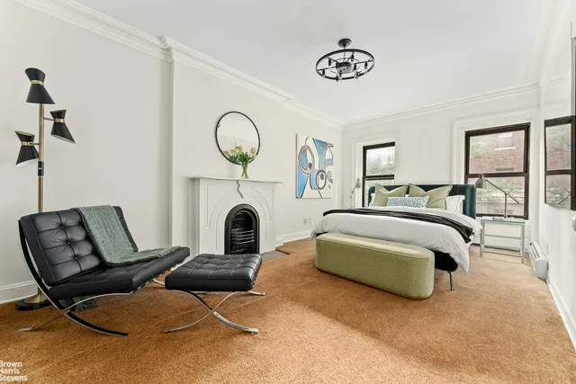 a bedroom with a bed and a couch