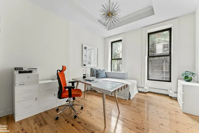 a view of a chairs and table in a backyard