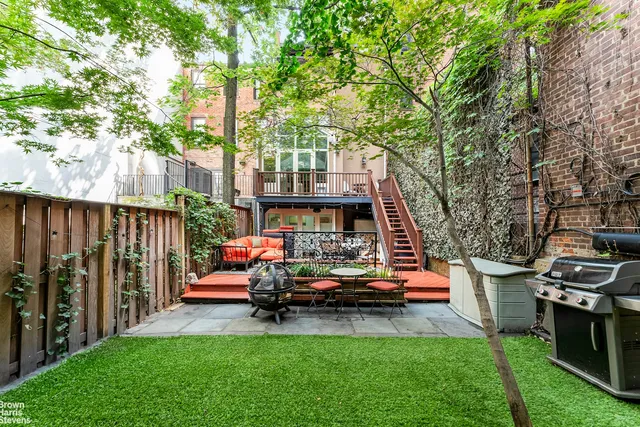 an outdoor sitting area with a couch swing table and chairs