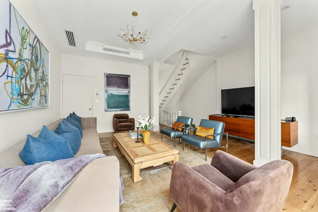 a black and white photo of a living room