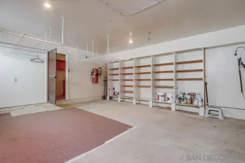 a view of a backyard with plants and a small pool