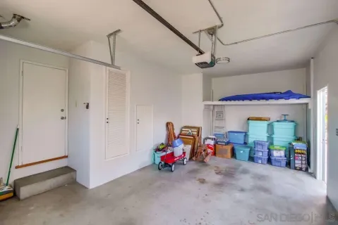 an aerial view of multiple houses with a yard