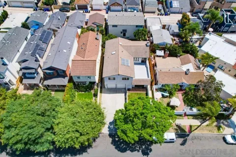 an aerial view of a house with outdoor space