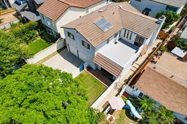 a front view of a house with a yard and porch