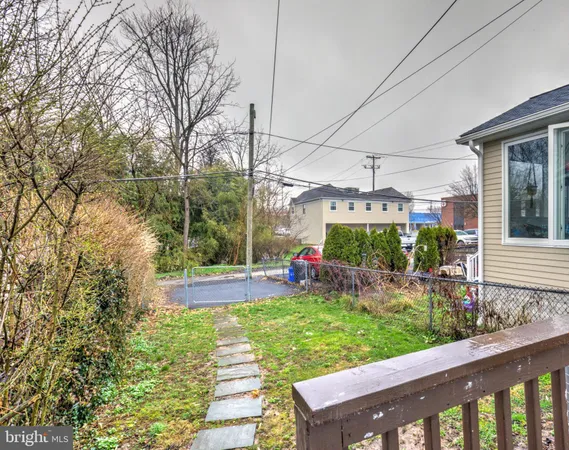 a view of a backyard with sitting area