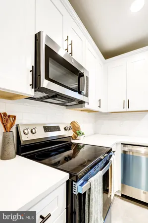 a kitchen with a stove and a microwave