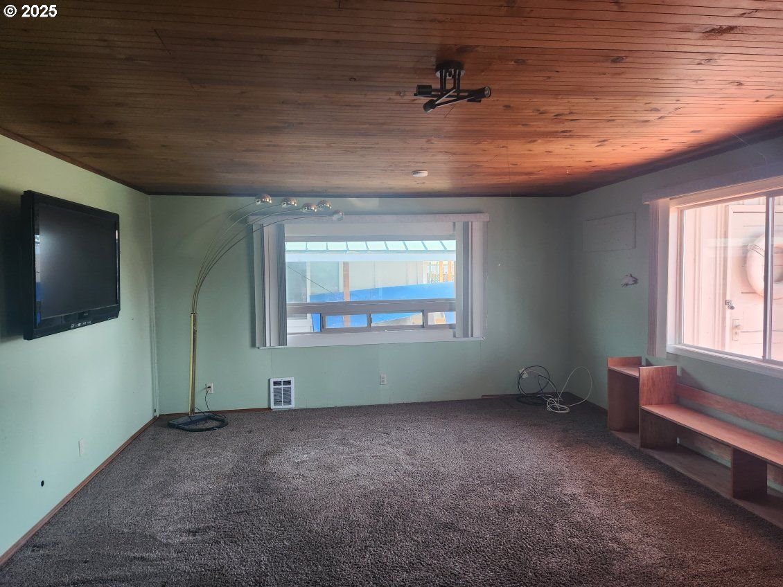50350 Cowens Road, Unit 8 Scappoose, OR 97056 - Photo 4 of 8 a view of an empty room with a window