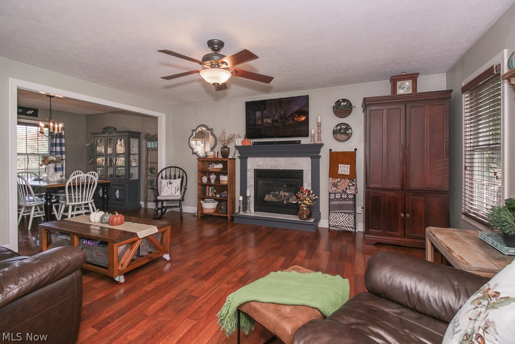 43440 Russia Road Elyria, OH 44035 - Photo 4 of 35 Great room features gas fireplace! Note laminate wood flooring, wide baseboards and encased doorways!
