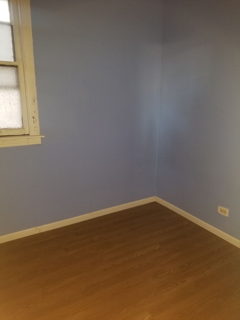 2453 West 46th Place, Unit 1 Chicago, IL 60632 - Photo 14 of 14 a view of an empty room with a window