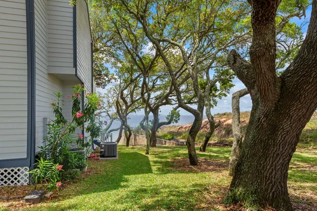 a large white kitchen with a large window