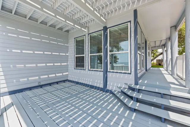 a large kitchen with a table and chairs