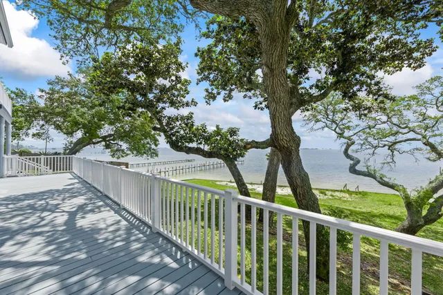 a view of a balcony with wooden fence