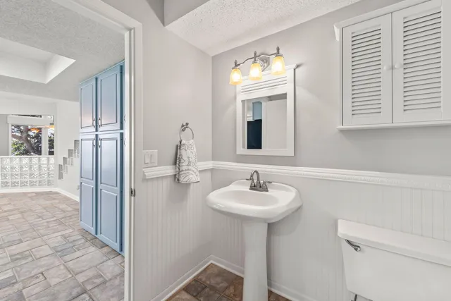 a bathroom with double sink and a mirror