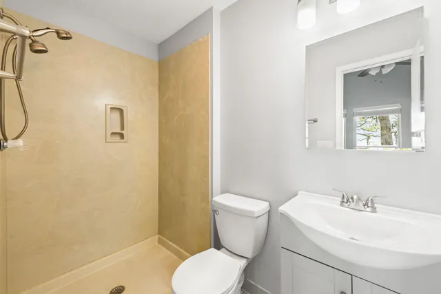 a bathroom with double sink and a mirror