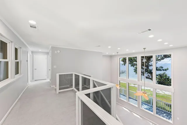 a view of a balcony with wooden fence
