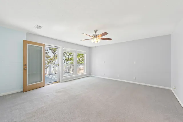 an aerial view of a house with yard