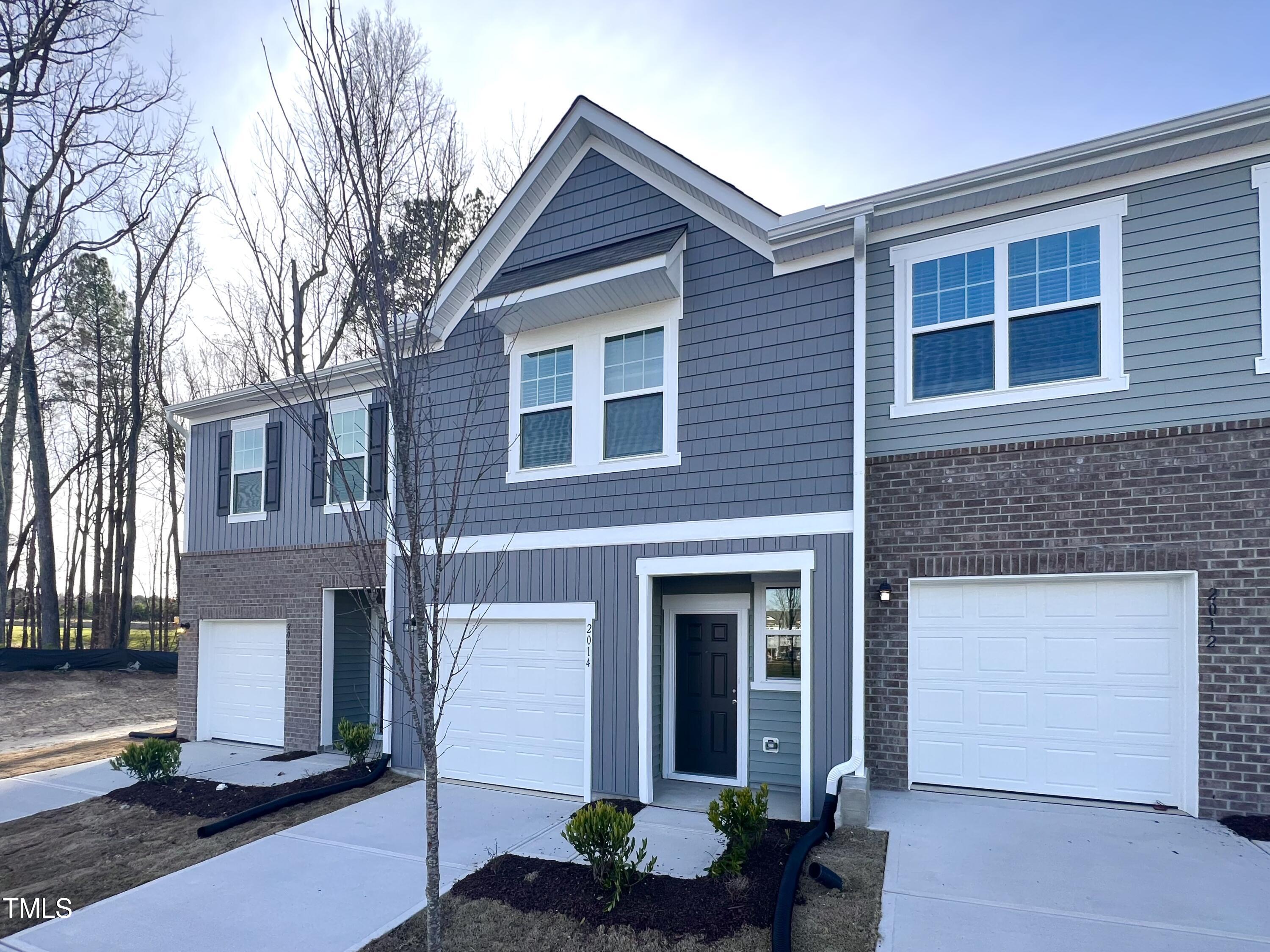 2014 Trailside Drive Durham, NC 27704 - Photo 3 of 9 a front view of a house with garage