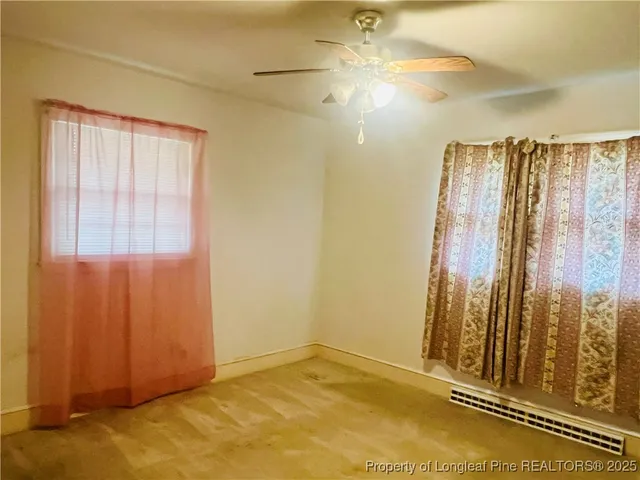 a view of a room with wooden walls