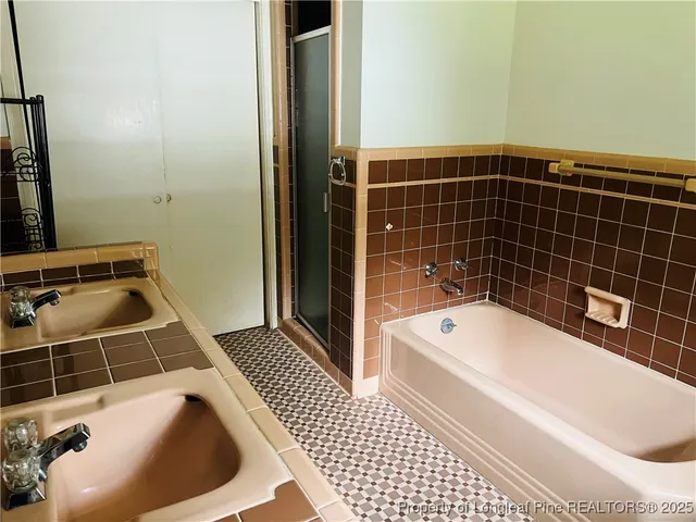 a bathroom with a bathtub and sink