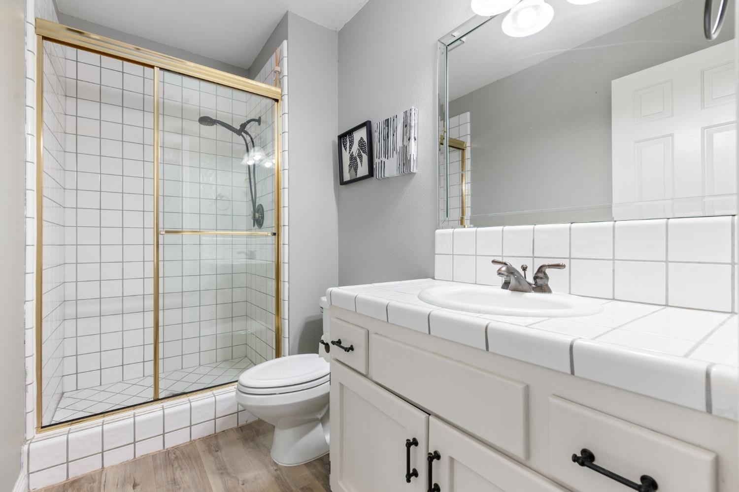 2128 Swift Avenue Clovis, CA 93611 - Photo 11 of 25 a bathroom with a sink toilet and shower