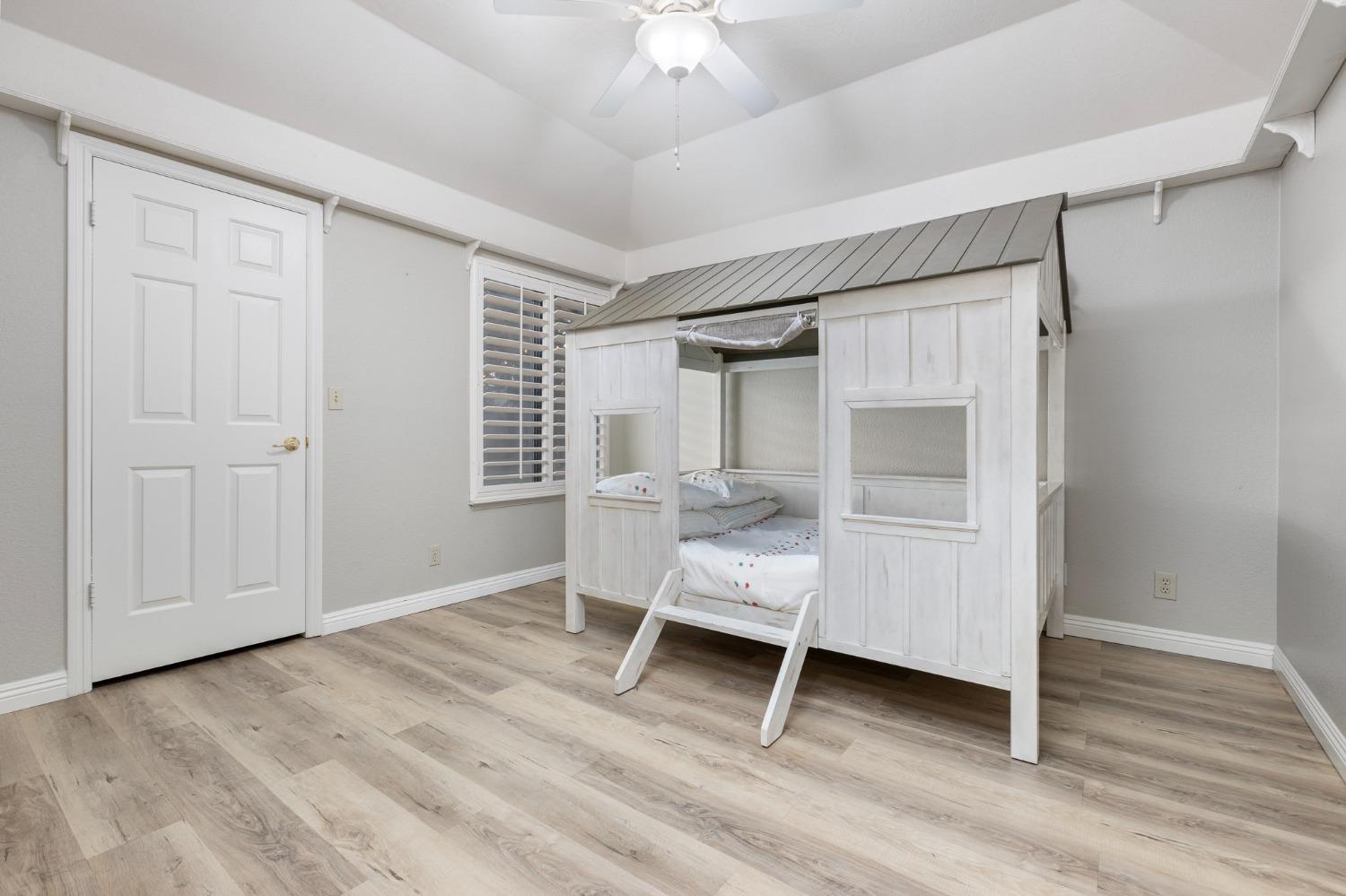 2128 Swift Avenue Clovis, CA 93611 - Photo 12 of 25 a living room with a chair and a table