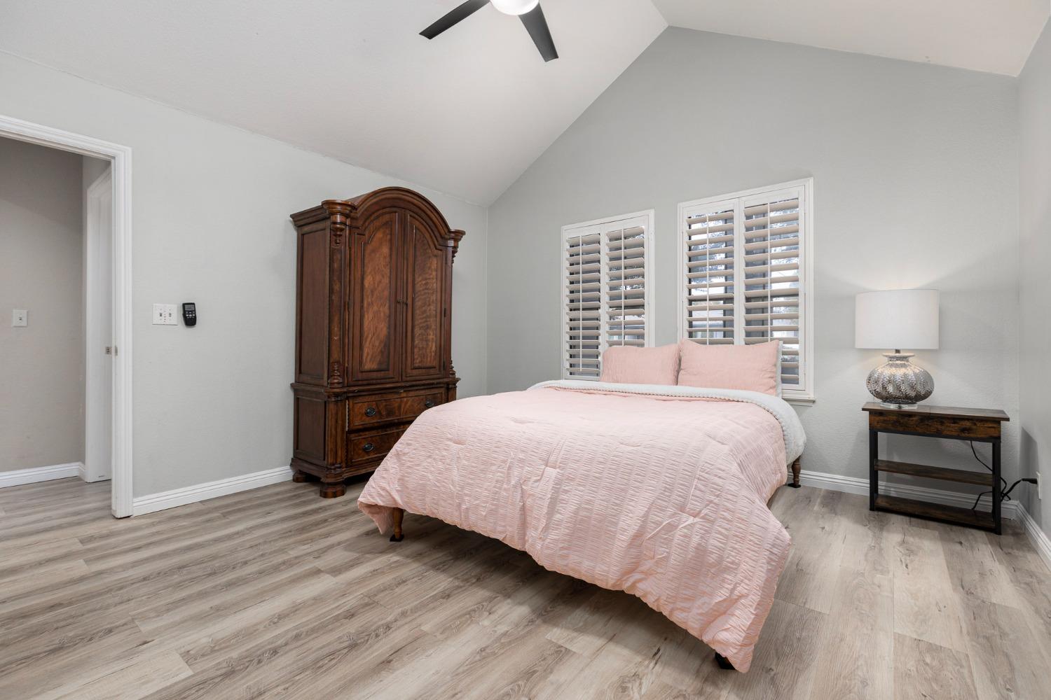 2128 Swift Avenue Clovis, CA 93611 - Photo 18 of 25 a bedroom with a bed and a window