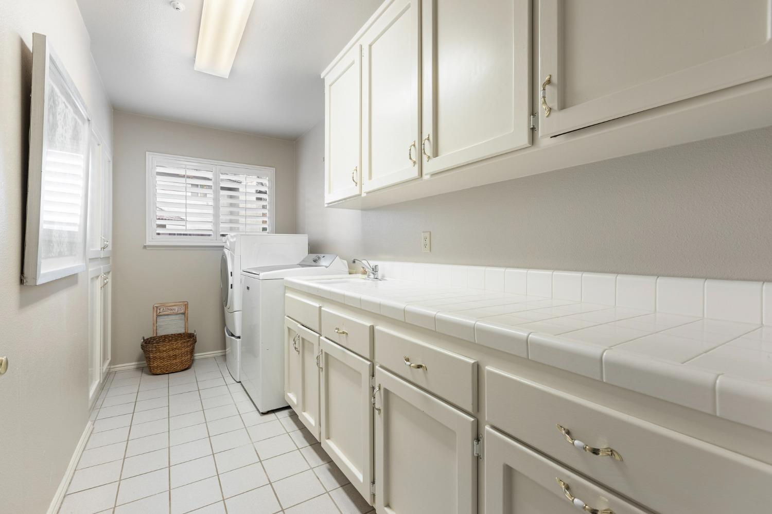 2128 Swift Avenue Clovis, CA 93611 - Photo 19 of 25 a kitchen with a sink cabinets and window
