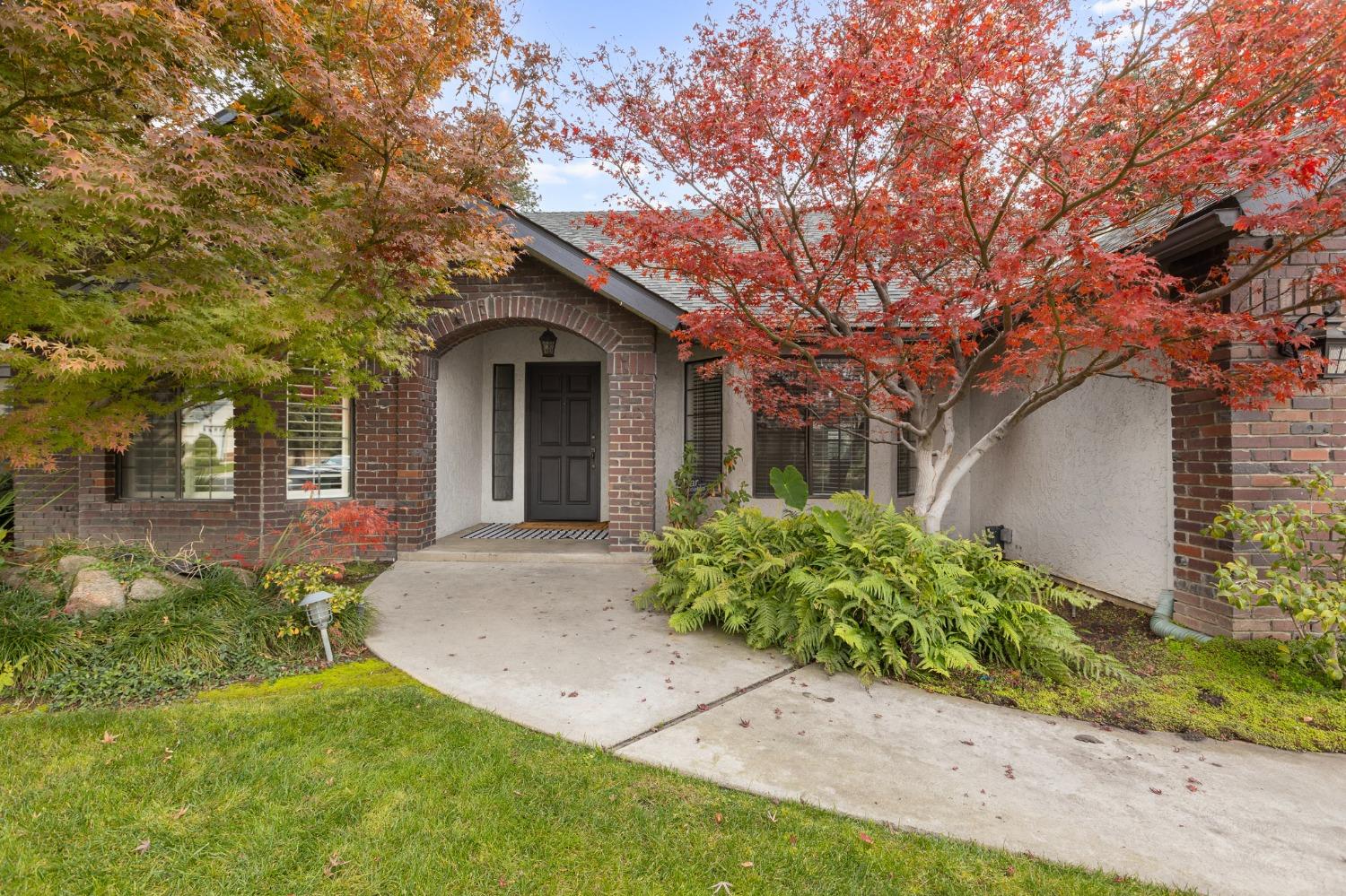 2128 Swift Avenue Clovis, CA 93611 - Photo 2 of 25 front view of a house with a yard
