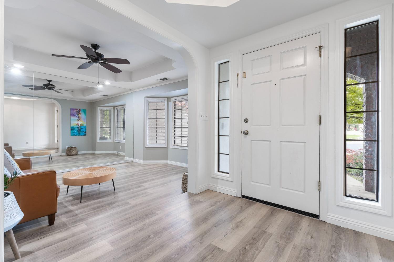 2128 Swift Avenue Clovis, CA 93611 - Photo 3 of 25 a view of a livingroom with furniture and wooden floor