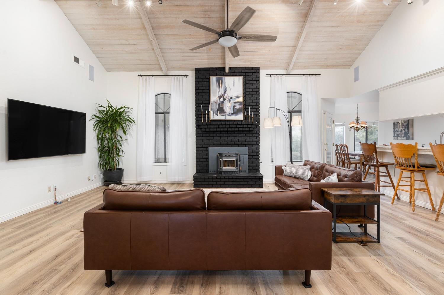 2128 Swift Avenue Clovis, CA 93611 - Photo 5 of 25 a living room with fireplace furniture and a flat screen tv