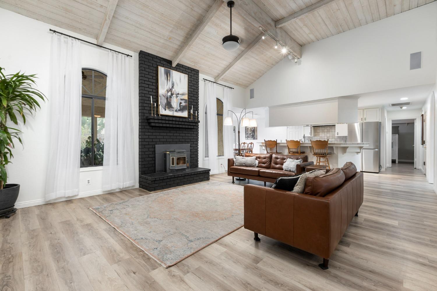 2128 Swift Avenue Clovis, CA 93611 - Photo 6 of 25 a living room with furniture and a fireplace