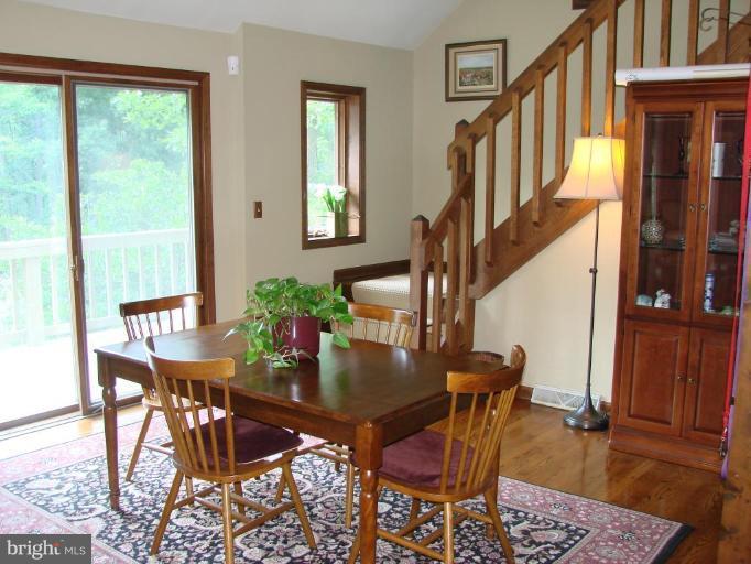 6711 Carters Run Road Marshall, VA 20115 - Photo 8 of 16 a view of a dining room with furniture and a window