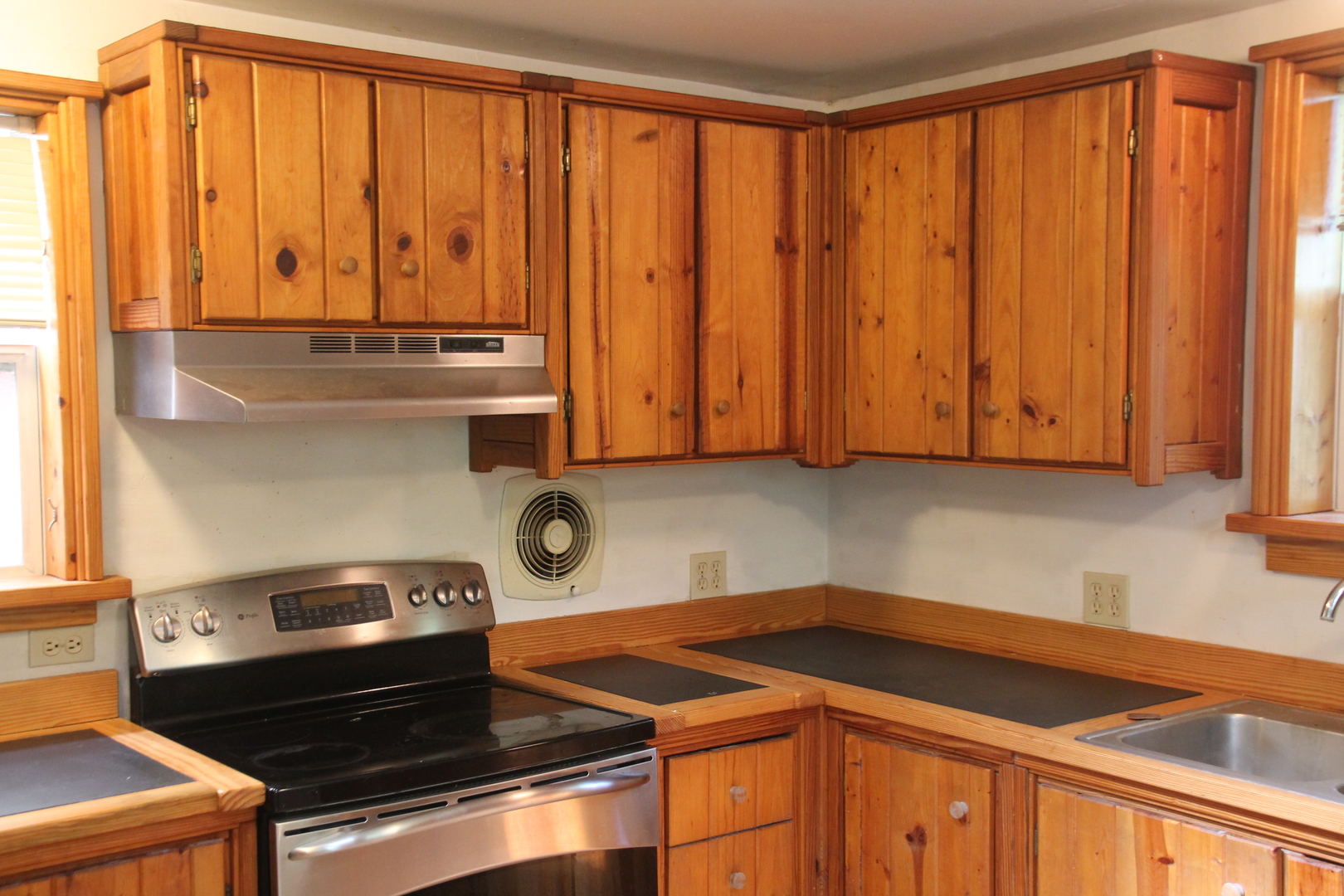 1150 N Homer, IL 61849 - Photo 17 of 32 a kitchen with a stove and a sink