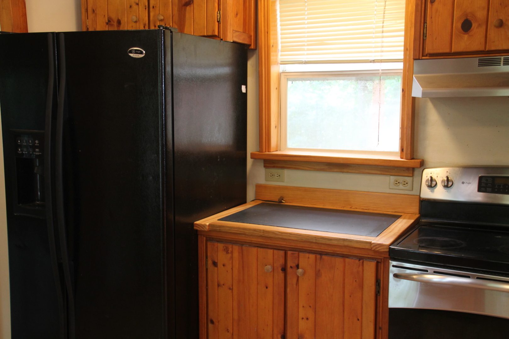 1150 N Homer, IL 61849 - Photo 18 of 32 a kitchen with a sink and a refrigerator