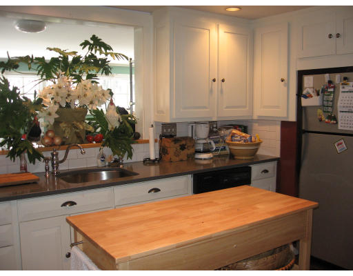 42 Sheldon Road Newton, MA 02459 - Photo 6 of 9 a kitchen with stainless steel appliances granite countertop a sink stove and cabinets